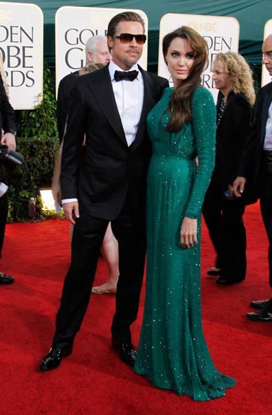 Brad Pitt and Angelina Jolie; Jolie is wearing Versace